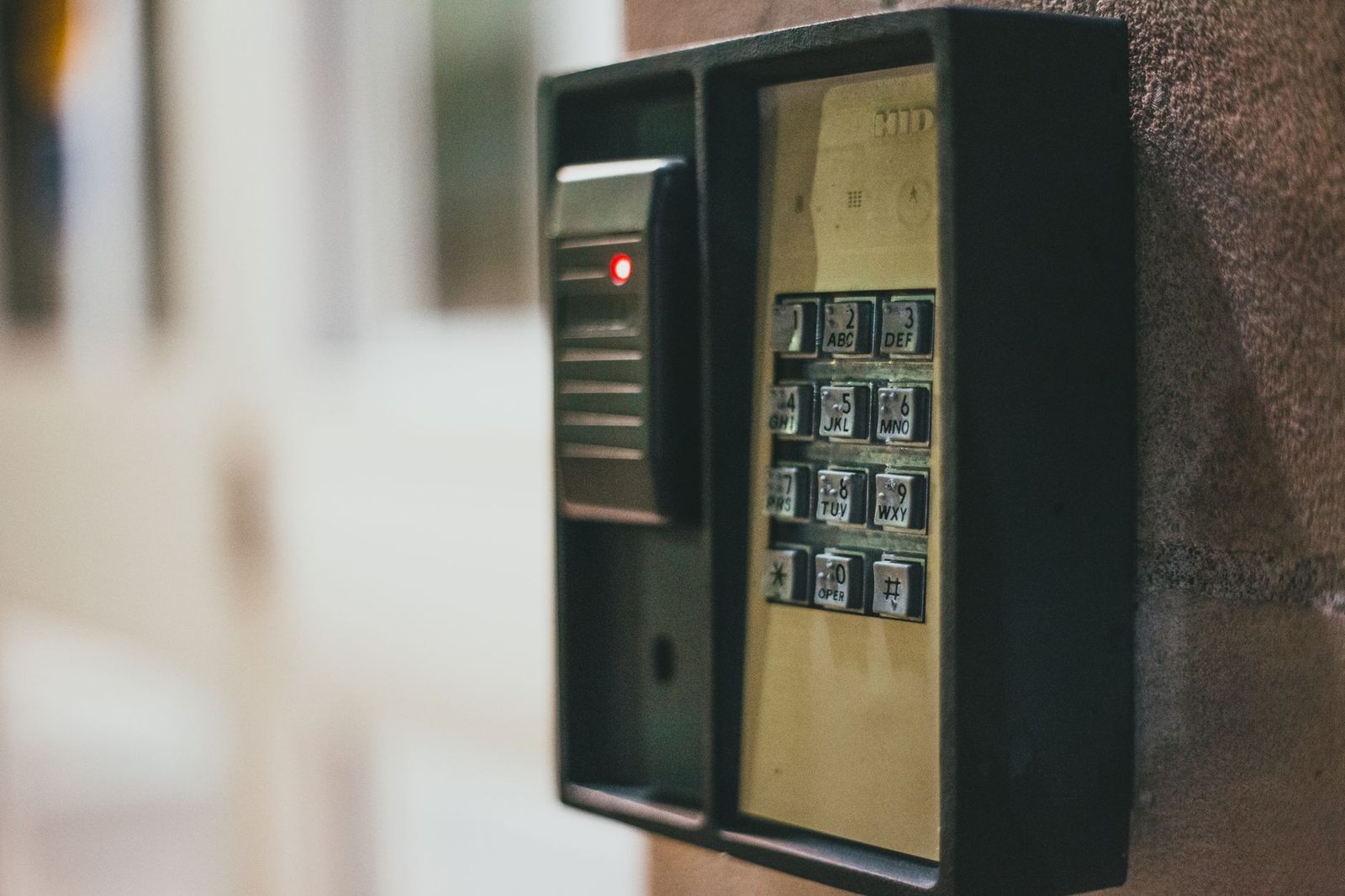 Close-up of a security access control keypad with illuminated buttons for keyless entry.