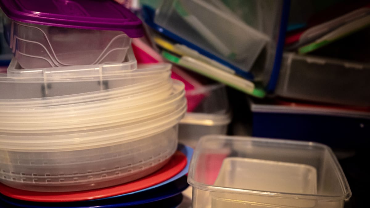 A variety of plastic storage containers stacked together, ideal for organizing kitchen spaces.