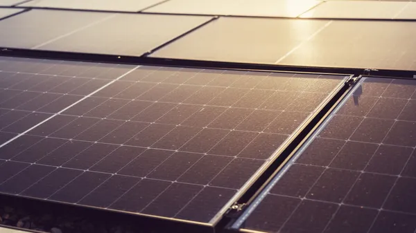 Detailed view of solar panels capturing sunlight, highlighting renewable energy technology.