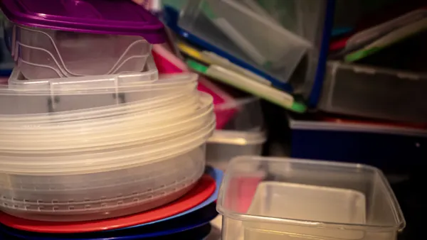 A variety of plastic storage containers stacked together, ideal for organizing kitchen spaces.
