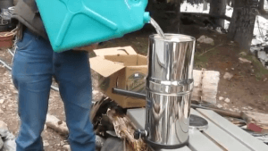 Man filling a family water filter